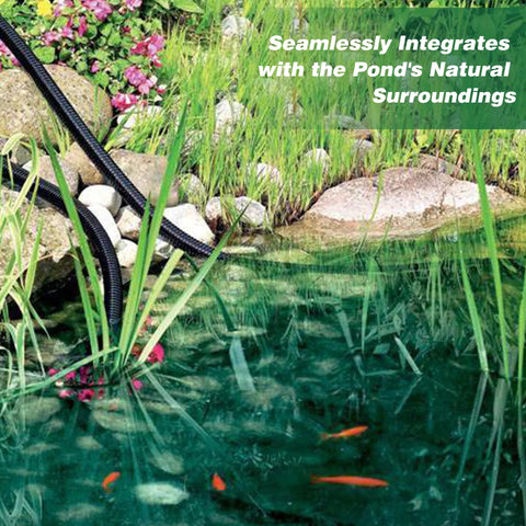Side view of black corrugated pond hose, 1-inch ID, laid along a garden pond edge among rocks and aquatic plants.