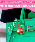 Premium Metal Lobster Clasps With Smooth Rollin Rings For Custom Keychains And Craft Supplies used with a red charm on a green tote.