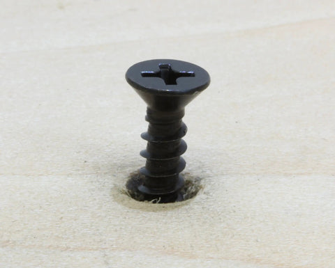 Badass 18-8 Stainless Steel Flat Head Phillips Wood Screws 8 X 3/4 Inch Black Oxide Coated embedded in wood surface.