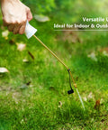 Hand using Diatomaceous Earth Bulb Duster With Long Copper Tube Garden Sprayer Applicator for pest control in a yard