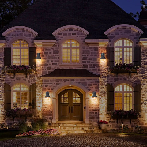 Two Pack Outdoor Wall Sconces With Hammered Metal Shade And Gold Interior illuminating elegant house facade at night