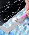 Diamond Painting Ruler With 1020 Blank Grids And Diamond Mesh Alignment Tool for 5D art, round drill guide in use on canvas.