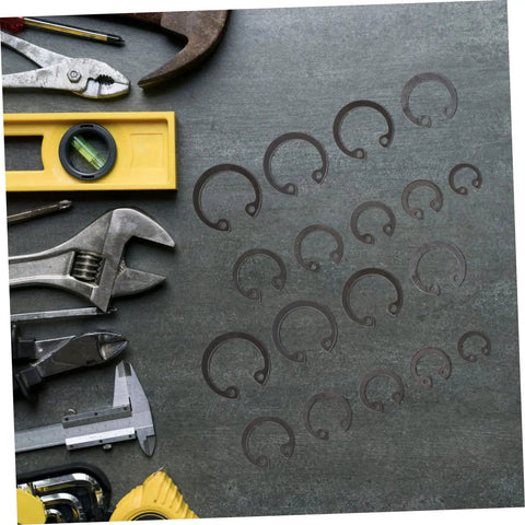 100 Piece Steel Snap Ring Set For Shafts And External Circlips with tools on a workbench for mechanical projects.