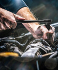 Mechanic using Beast Mode Impact Socket Set With Three Eighths Inch Drive Fifty Piece SAE And Metric 6 Point Sockets on car engine