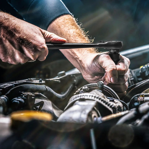 Mechanic using Beast Mode Impact Socket Set With Three Eighths Inch Drive Fifty Piece SAE And Metric 6 Point Sockets on car engine