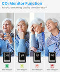 Senior woman using CO2 Monitor With Voice Alerts, Indoor Air Quality Meter, Large Display CO2 Tester, Temperature And Humidity Sensor.