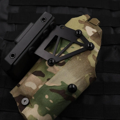 Dang Tough And Zero Drama Rig 21 Set Chicago Screw Kit for Kydex and leather gun holsters attached to camo fabric.