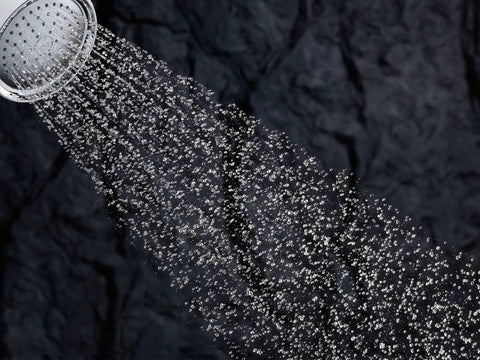 Bancroft 2.5 GPM Single Function Showerhead With Katalyst Air Induction Technology sprays water, showing consistent flow.