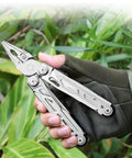 All In One 16 In 1 Multitool Pliers With Spring Loaded Pliers Head held outdoors in gloved hand