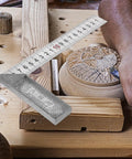 90 Degree L Square Stainless Steel Carpenter Ruler For Woodworking And Engineering on workbench with wood carving
