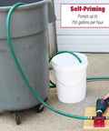 Person using a Drill Pump Attachment With Self Priming Water Transfer Pump For Drills, 750 GPH, transferring water between containers.