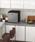 Keep Your Stash Ice Cold With This Sick 1.1 Cu Ft Countertop Freezer in a modern kitchen setting with utensils and decor.