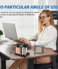 Woman using Workhorse Portable Label Dispenser With Dual Sensors And Three Speed Modes For Shipping Packages on desk