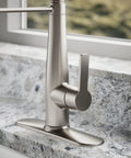 Slick Stainless Steel Kitchen Sink Faucet With Built In Soap Dispenser And Heavy Duty Pull Down Sprayer, close-up on lever.
