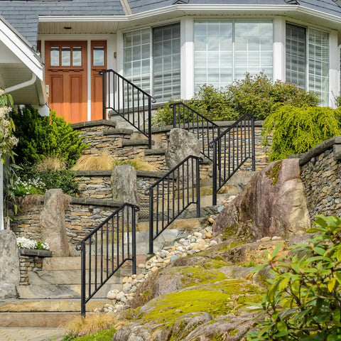 Heavy Duty Wrought Iron Handrails For Outdoor Steps, resilient porch grab bars on stone steps leading to a house entrance.
