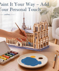 3D Wooden Puzzle For Adults Notre Dame Cathedral Model Kit 330 Piece DIY Architecture craft being painted