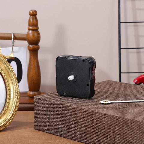 WhisperSilent Quartz Wall Clock Movement Kit With 8mm No Thread Shaft For DIY Projects And Home Decor on a table.
