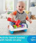Baby playing with Toddler Tap And Turn Tool Bench Play Set For Tiny Tot Builders, Kid Friendly, A Two Sided Construction Toy With Five Colorful Shape Pegs, Easy Grasp Hammer, Flip For Double Play, Teaches Colors And Shapes And Builds Fine Motor Skills, Fisher-Price indoors