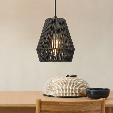 7 Inch Handwoven Rattan Pendant Light With Matte Black Basket Shade in cozy dining setting