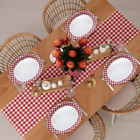 Kickin Vibes Red Gingham Oval Paper Plates 40 Count 10 X 12 Inch Heavy Duty Disposable setting on a dining table with florals.