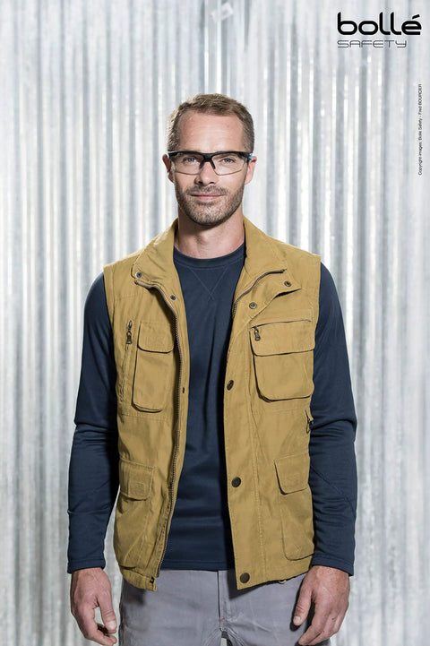 Man wearing Tryon Platinum Safety Glasses With Ultra Wraparound Fit Black Blue Frame Clear Lenses FLEX 160 Temples.