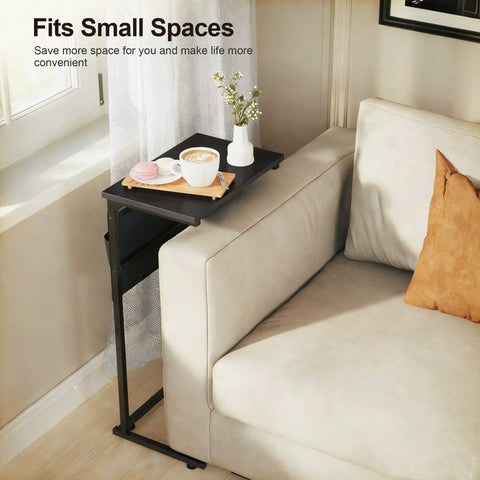 C Shaped End Table With Sliding Tray Under Sofa 28 Inch High Side Table With Storage Bag Black next to cream sofa and window