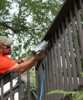 Man using power tool with Lightweight Yet Durable Rubber Air Hose Three Eighths Inch By Fifty Feet, 300 PSI attached outdoors
