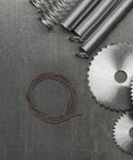 Heavy Duty Manganese Steel Mechanical Extension Spring With Secure Hooks For Pottery Heater Induction And High Heat Resistance Traction Kit coiled on metal surface