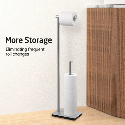 Freestanding Toilet Paper Holder Stand With Reserve Storage In Rustproof Stainless Steel Brushed Finish beside wooden cabinet.