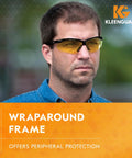 Man wearing V30 Nemesis Safety Glasses With Amber Yellow Lenses And Black Frame, Unisex Fit For Men And Women, 12 Pairs, Lightweight Eye Protection That Blocks Nearly 100 Percent UVA UVB UVC, ANSI Z87.1 Standard.