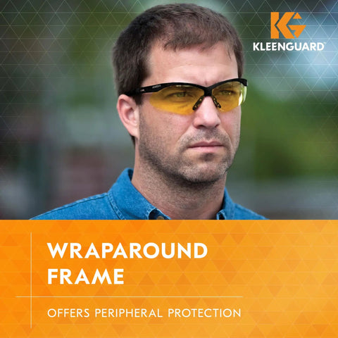 Man wearing V30 Nemesis Safety Glasses With Amber Yellow Lenses And Black Frame, Unisex Fit For Men And Women, 12 Pairs, Lightweight Eye Protection That Blocks Nearly 100 Percent UVA UVB UVC, ANSI Z87.1 Standard.