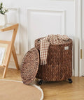 Round Water Hyacinth Storage Basket With Lid And Wheels Boho Chic Natural Rattan Bin shown as ottoman in living room