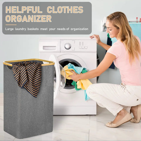 Gray Collapsible Laundry Basket 105L Tall Foldable With Bamboo Handle for Bedroom Bathroom and Laundry Room next to washing machine