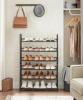 Sturdy 3 Tier Shoe Organizer Rack For Closet And Entryway, Holds 12 pairs, metal shoe shelf, black, in use by front door.