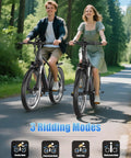 Two riders on Powerful 1500W Peak Electric Mountain Bike For Adults on forest trail showcasing riding modes.