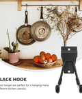 Rock Solid Black Metal Wall Hooks For Bags And Hats With Heavy Duty Mount That Keeps Your Space Looking Crisp And Organized Without Any Hassle For Hanging Coats And Towels In The Garage Or Bathroom Too, mounted black hook holding kitchen utensils.