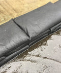 Grab And Go Flood Kit With 20 Water Activated Flood Bags In A Bucket, black barriers absorbing water on pavement