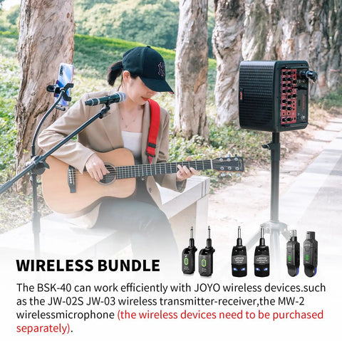 Musician playing guitar with 40W Portable Acoustic Guitar Amp With Rechargeable Battery Bluetooth And USB C Recording outdoors.