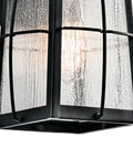 Close-up of Tolerand 12 Inch Outdoor Wall Light In Textured Black With Clear Seeded Glass 1 Light Exterior Sconce For Porch And Patio