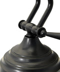Close-up of the 12 LED Piano Desk Lamp With Dimmer In Oil Rubbed Bronze Perfect For Your Dope Home Studio Or Keyboard Desk Eye Friendly Lighting Ultra Low Heat Energy Efficient LEDs Last Over Fifty Thousand Hours Keeps Your Workspace Bright And Comfortable, showcasing adjustable joint in bronze finish.