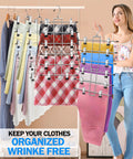 Woman displaying three pack closet organizers with six tier pants hangers with clips for space saving wardrobe organization.