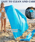 Portable 57x60 Inch Picnic Blanket Waterproof Sandproof Quick Dry Beach Mat held by woman on sandy beach.