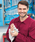 Man in red shirt using Cotton Shop Towels 14 By 12 Inches 145 Pack Reusable Cleaning Rags For Automotive Garage Workshop And Industrial Use