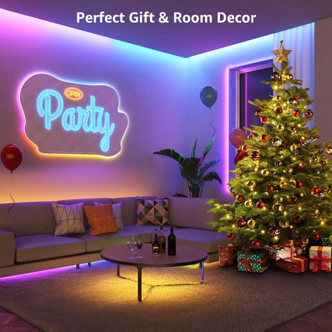 DreamColor LED Strip Lights 16.4ft Music Sync RGB 5050 LED Tape with Remote illuminating party room with Christmas tree.