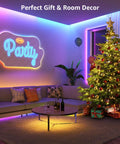 Living room with DreamColor 50ft LED Strip Lights With Remote, Rainbow Chasing Colors above sofa and near Christmas tree.