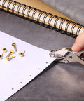 300 Pieces Three Quarters Inch Paper Fasteners Small Round Metal Brads With Hole Punch Included For Scrapbooking Crafts And DIY Gold Tone Rustproof Brass Plated Finish.