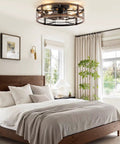 Bedroom with 20-Inch Caged Ceiling Fan With Light And Remote, Low-Profile Flush Mount Fandelier in black and brushed gold. 