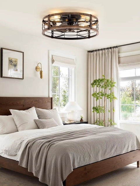 Bedroom with 20-Inch Caged Ceiling Fan With Light And Remote, Low-Profile Flush Mount Fandelier in black and brushed gold. 