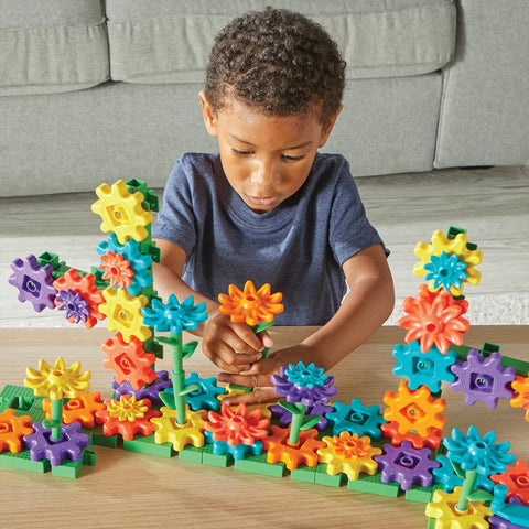 Child playing with 101 Piece Gear Building Set For Kids So They Can Build Twisting Gardens While Learning Cause Effect Sequencing And Early Engineering Hands On STEM Construction Toy Montessori Inspired Kid Friendly Fine Motor Play And Educational Engineering Gift