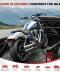 Heavy Duty Retractable Ratchet Straps 1 Inch By 10 Foot 4 Pack 1650 Lb Breaking Strength Rust Resistant Cargo Tie Downs securing a motorcycle in a truck.